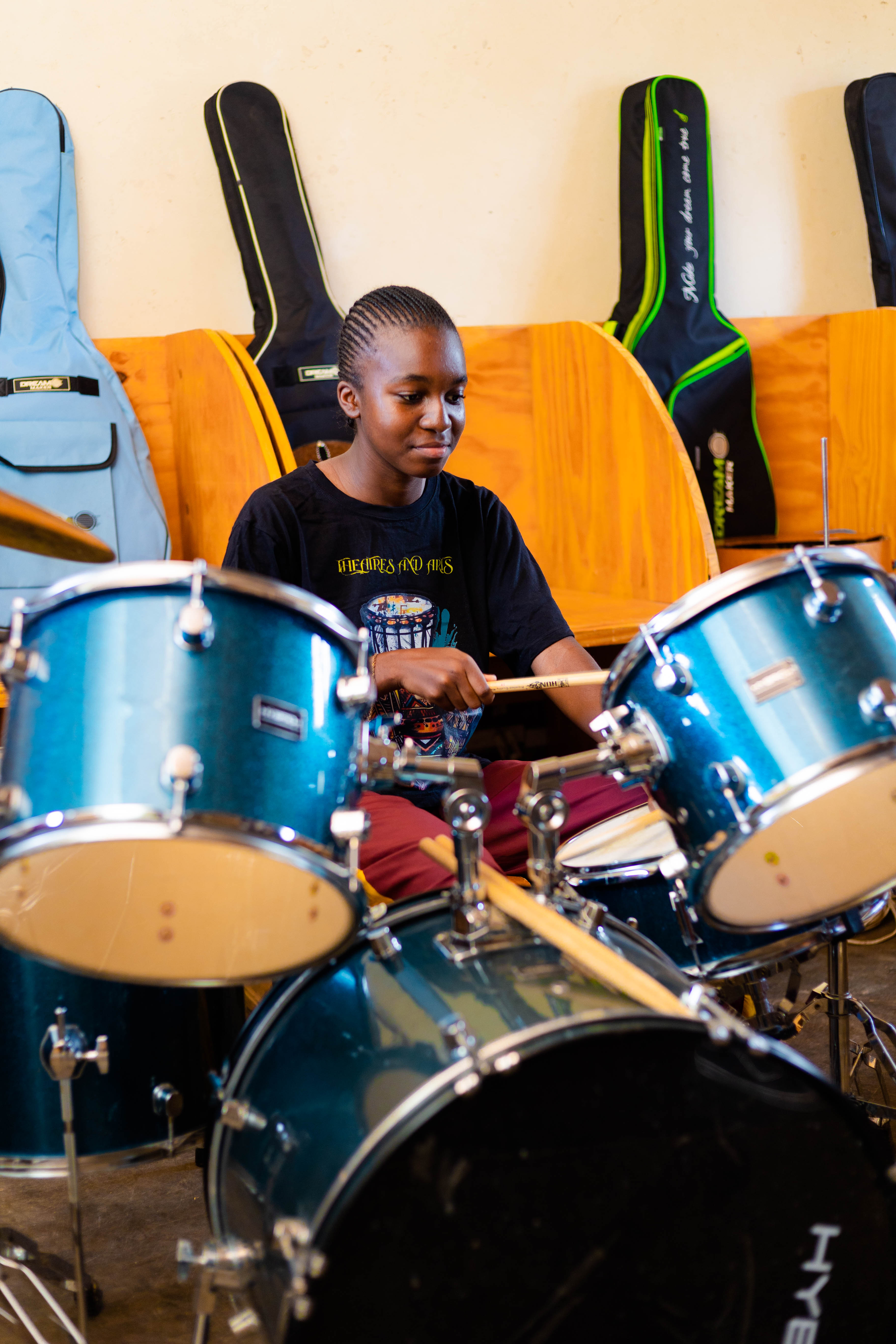 Student practicing drum performance