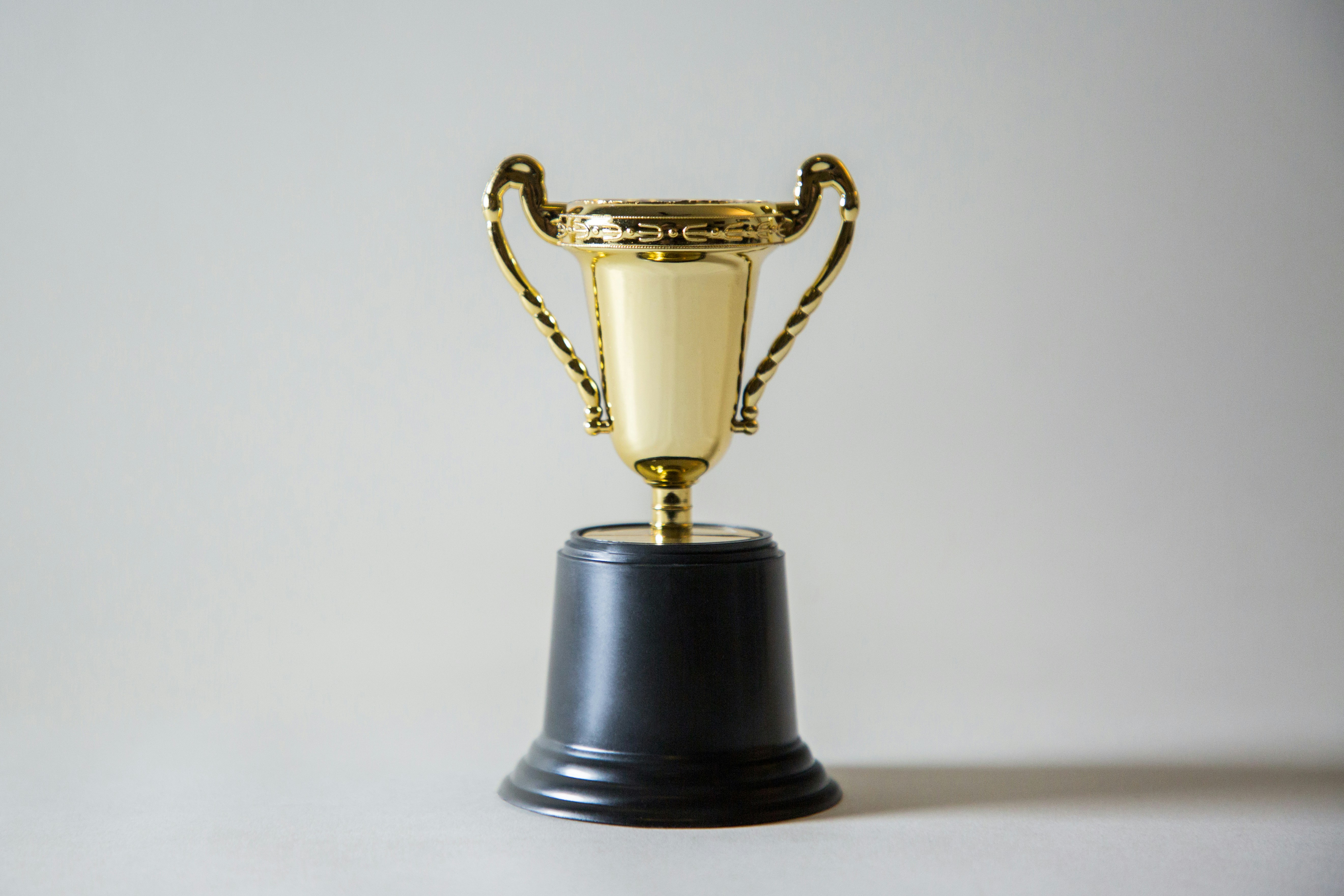 Trophy and certificates on a desk